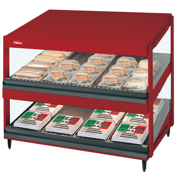 A red Hatco food display case on a counter with food in it.