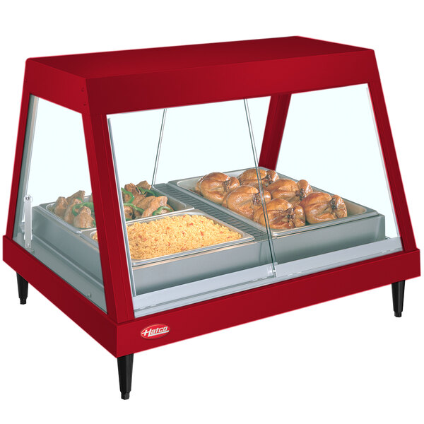 A red stainless steel Hatco countertop food warmer with food trays inside.