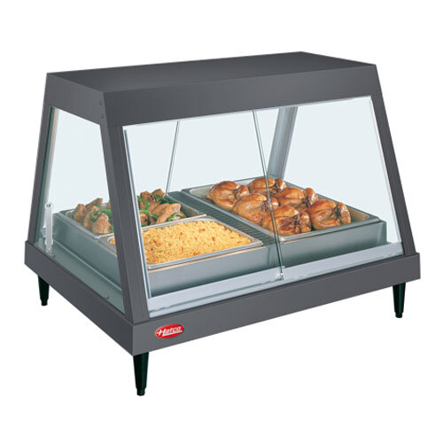 A Hatco countertop food warmer display case with cooked chicken on a tray inside.