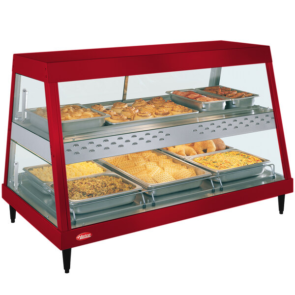 A red Hatco countertop display case with food trays inside.