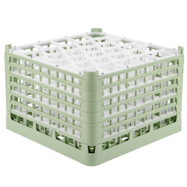 A Vollrath light green plastic glass rack with 30 compartments.