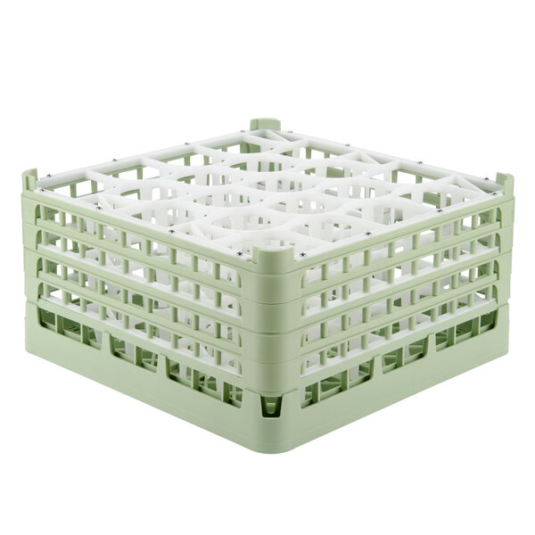 A light green Vollrath plastic rack with 20 compartments.
