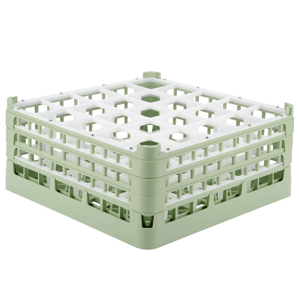 A light green plastic Vollrath glass rack with 25 compartments.