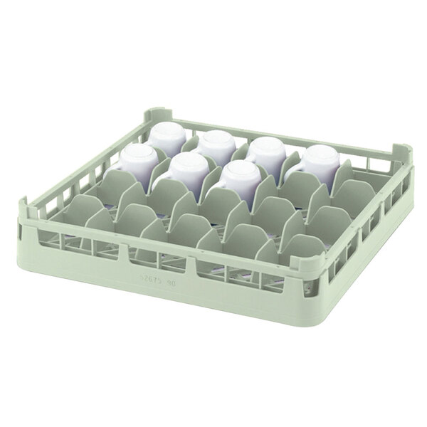 A Vollrath light green plastic rack holding white cups.