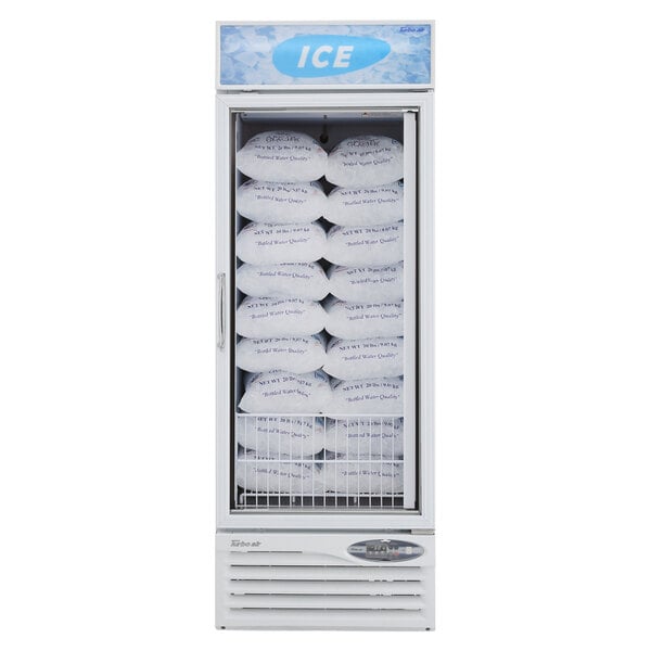 A white Turbo Air ice merchandiser full of bags of ice.