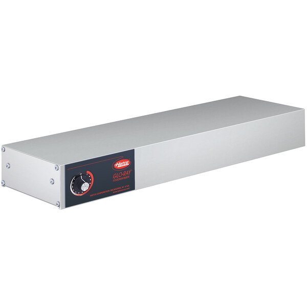 A rectangular stainless steel metal box with red and white buttons and a black label.