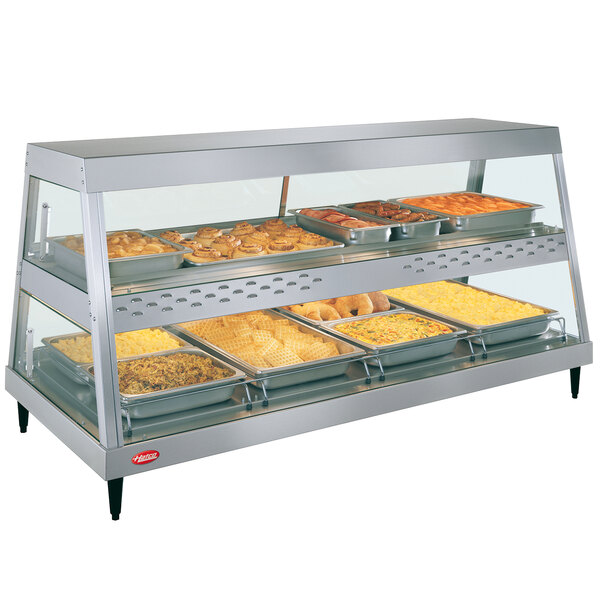 A stainless steel Hatco countertop food warmer display case with trays.