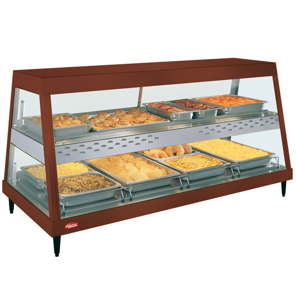 A Hatco countertop display case with food on trays.
