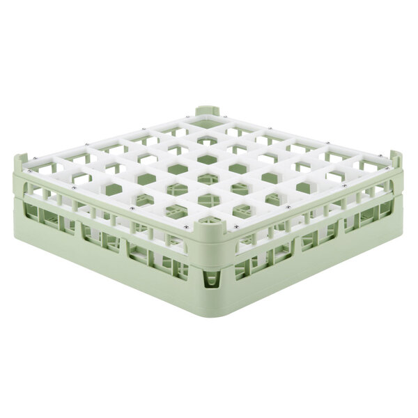 A light green Vollrath plastic rack with white compartments.