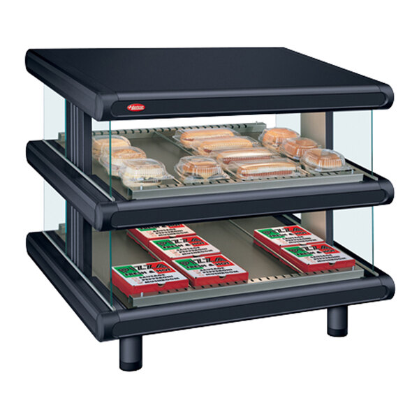 A black Hatco countertop display case with food on slanted shelves.