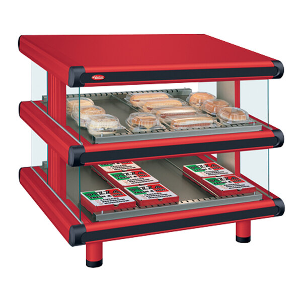 A red Hatco rectangular food display case with two shelves holding food.