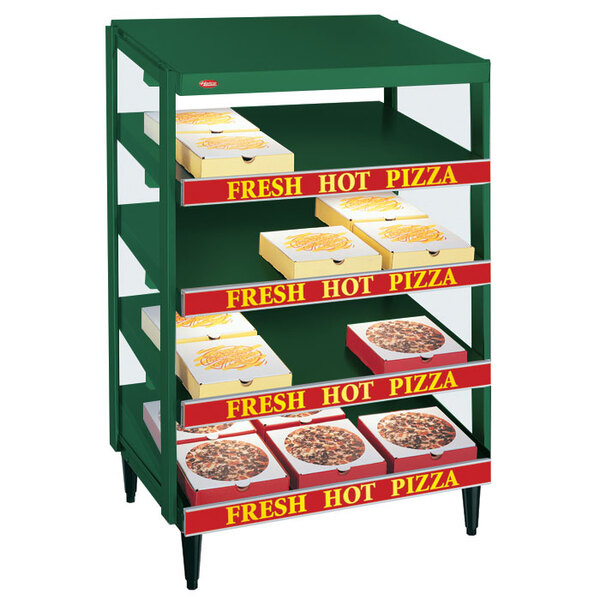 A green Hatco countertop pizza warmer with pizza on shelves.
