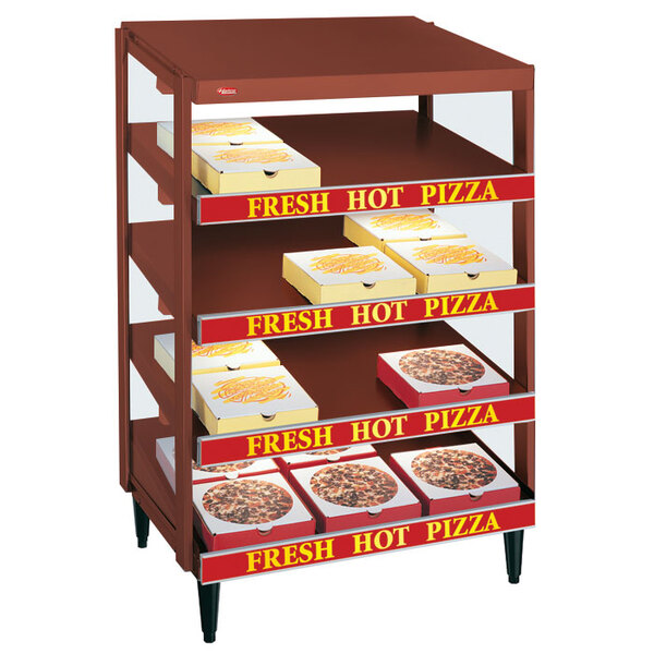 A Hatco copper pizza warmer with pizza boxes on the shelves.