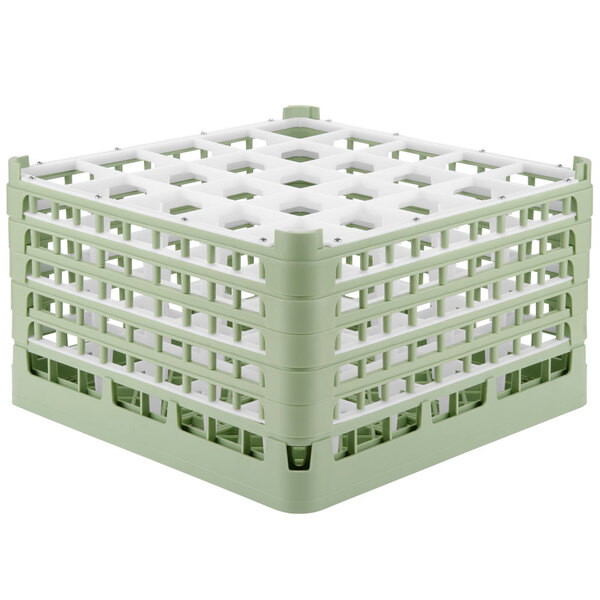 A light green plastic Vollrath glass rack with white squares.