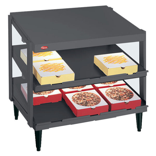 A Hatco Granite Gray Glo-Ray double shelf pizza warmer with pizza boxes on the shelves.