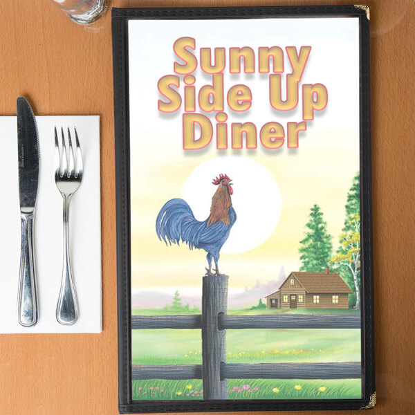 A menu with a rooster design on a table with a plate and a fork and knife.