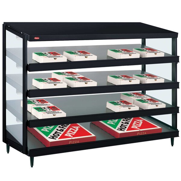 A black Hatco countertop display case with boxes of pizza inside.