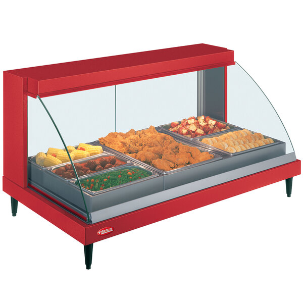 A red Hatco countertop food warmer display case with food inside.