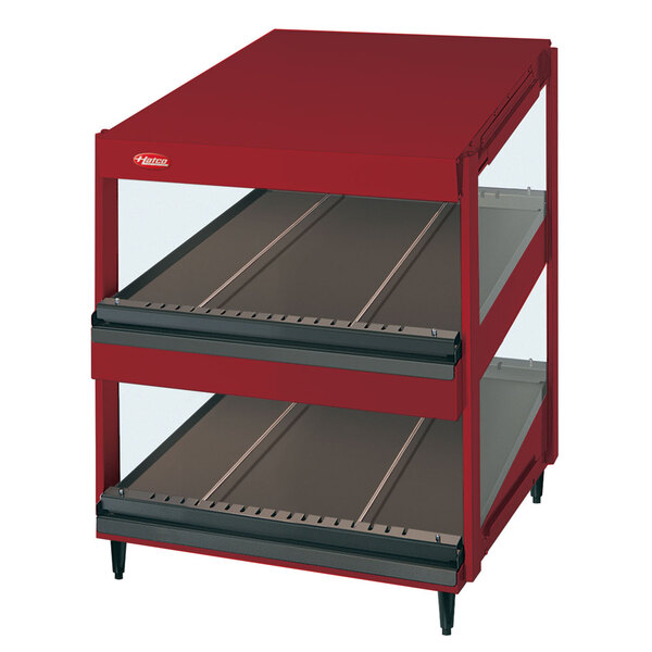 A red Hatco countertop display warmer with slanted glass shelves.