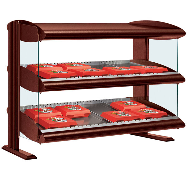 An Antique Copper Hatco horizontal double shelf merchandiser with red and brown shelves holding red boxes.