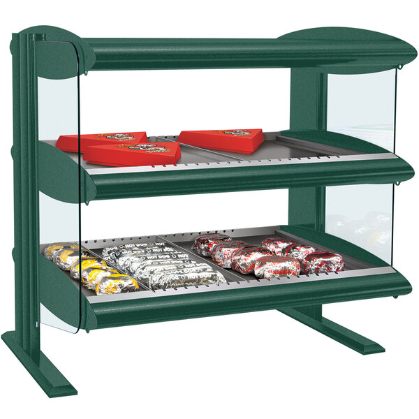 A Hunter Green Hatco horizontal double shelf food display case with food on it.