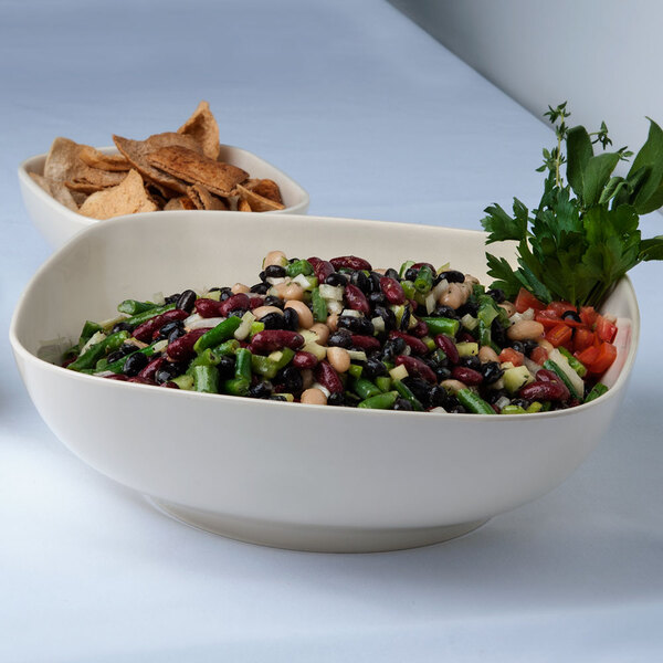 A Thunder Group Passion Pearl melamine square bowl with black bean salad and tortilla chips.