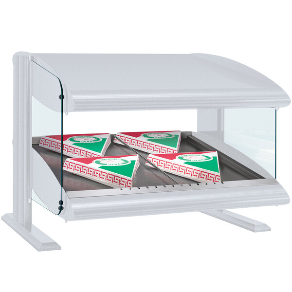 A white Hatco countertop food warmer with a slanted shelf holding pizza boxes.