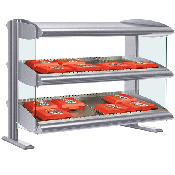 A gray Hatco countertop display shelf with LED lights displaying food.