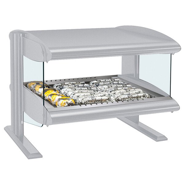 A Hatco white heated zone merchandiser with food on a tray inside.
