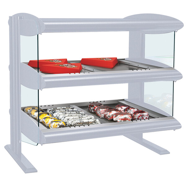 A white Hatco countertop heated zone merchandiser with food on shelves.