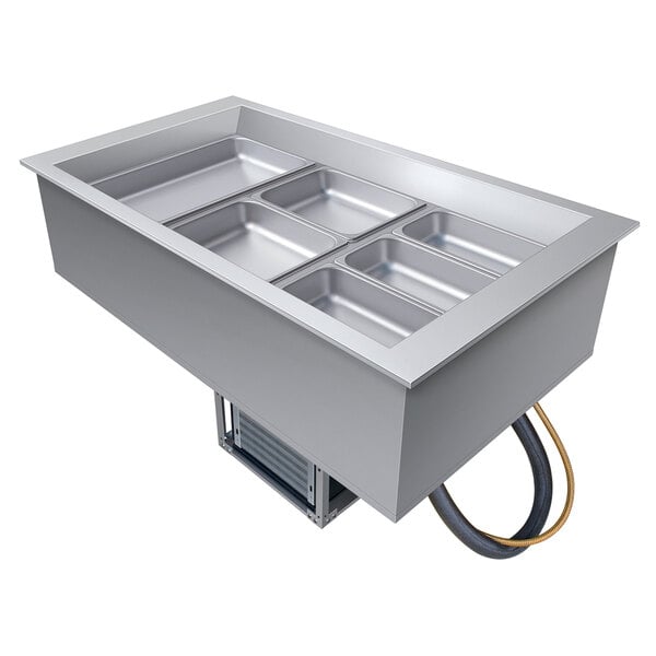 A Hatco drop-in cold food well with three rectangular silver pans inside.