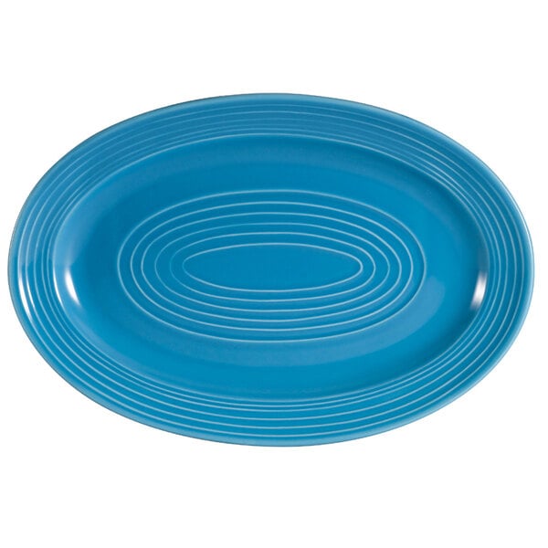 A blue oval platter with a white oval pattern.