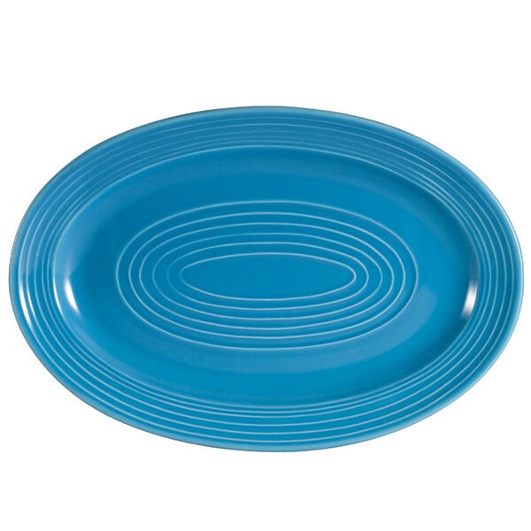 A blue oval platter with a white oval design.