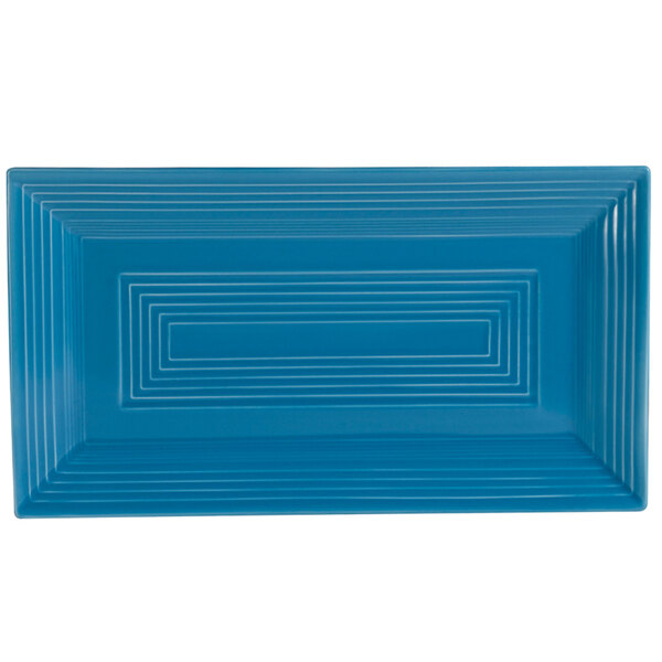 A blue rectangular platter with white lines forming a geometric design.