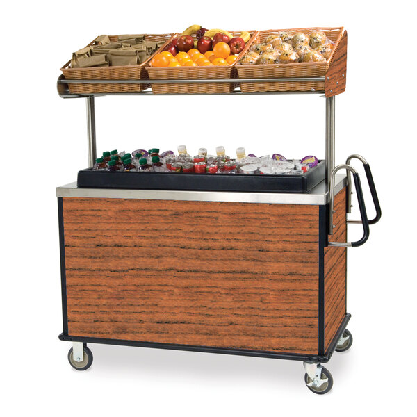A Lakeside vending cart with fruit and drinks on the counter and shelf.