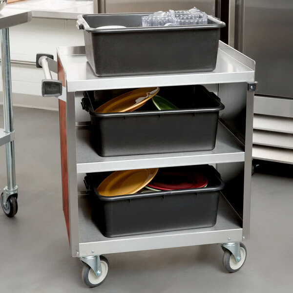 A Lakeside stainless steel utility cart with trays on it.