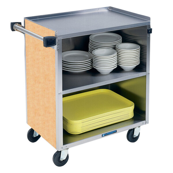 A Lakeside stainless steel utility cart with an enclosed base holding plates.