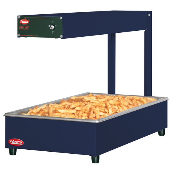 A navy Hatco portable food warmer with french fries on top.