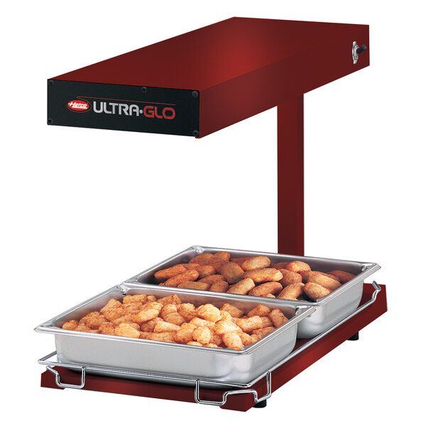 Hatco Ultra-Glo portable food warmer with trays of food on a stand.