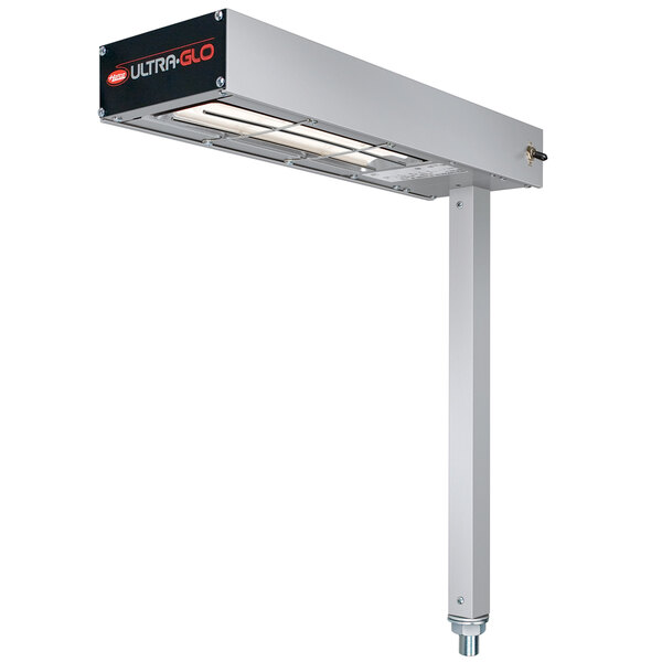 A Hatco Glo-Ray fry station overhead warmer with ceramic elements over a metal shelf.