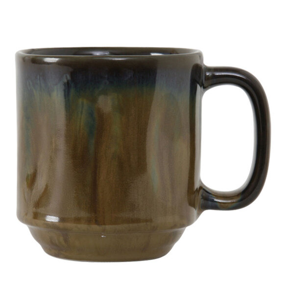 A brown Tuxton Yukon china mug with a blue and green design and a handle.