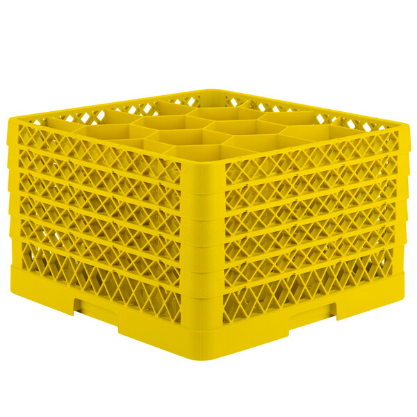 A yellow plastic Vollrath Traex rack with 12 compartments.