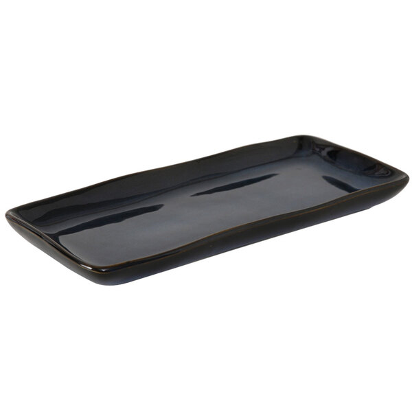 A black rectangular Tuxton china tray.