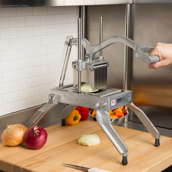 A person using a Nemco Easy Onion Slicer to cut an onion.