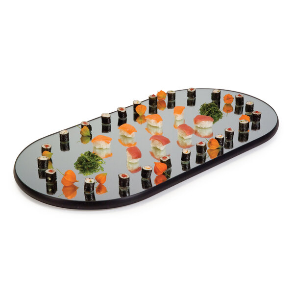 A Geneva oval mirror food display tray with sushi and other food on it.