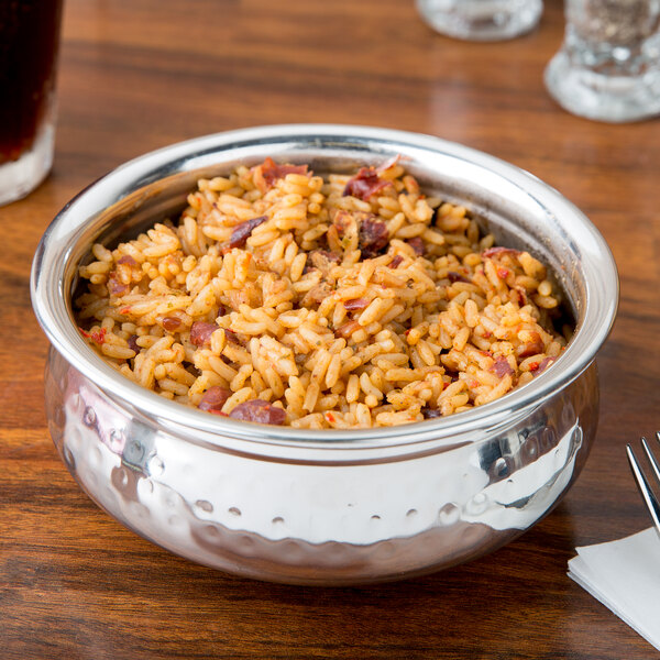 An American Metalcraft stainless steel bowl filled with rice and beans on a table.