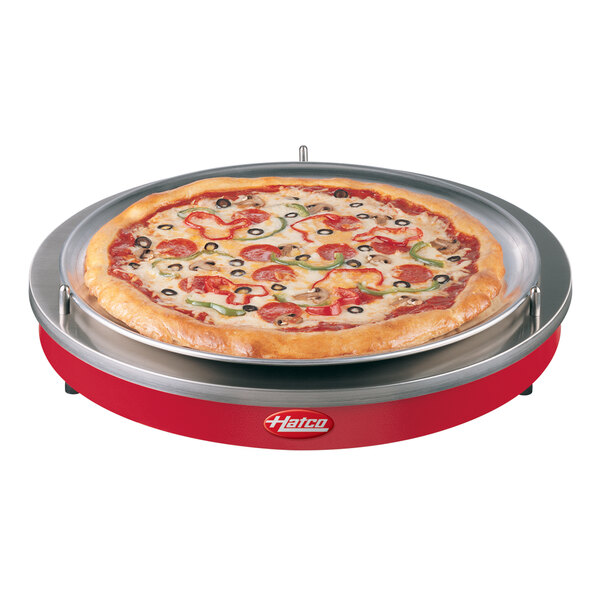 A pizza on a Hatco warm red heated shelf.