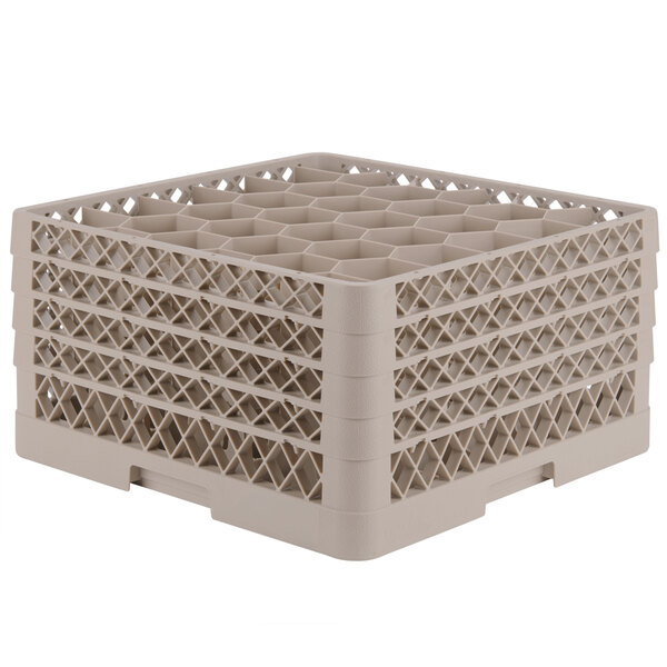 A beige plastic Vollrath glass rack with a grid of small compartments.