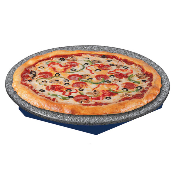A pizza on a Hatco heated stone shelf with a blue and gray granite base.