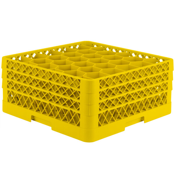A yellow plastic Vollrath Traex glass rack with 30 compartments.
